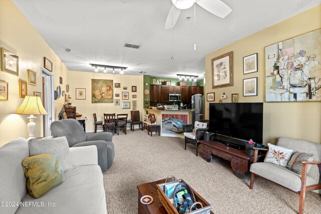 605 Fairway Dr Unit 205, Saint Augustine, FL 32084 - living room with carpet flooring, track lighting, and ceiling fan