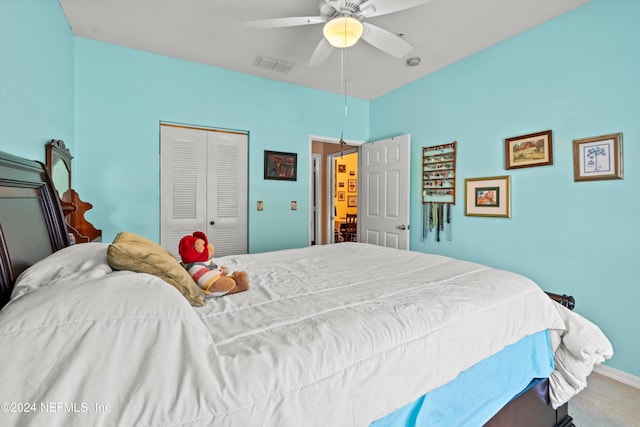 bedroom featuring ceiling fan, a closet, and carpet floors