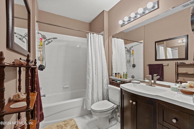 full bathroom featuring tile patterned flooring, vanity, shower / tub combo with curtain, and toilet