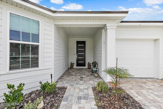 entrance to property featuring a garage