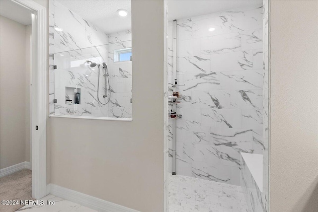 bathroom featuring a tile shower