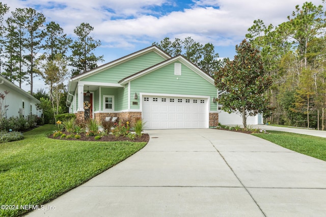 view of front of house featuring a front yard and a garage