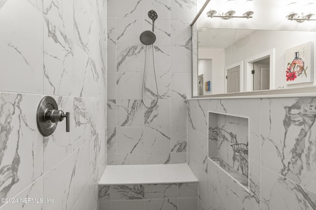 bathroom featuring tiled shower