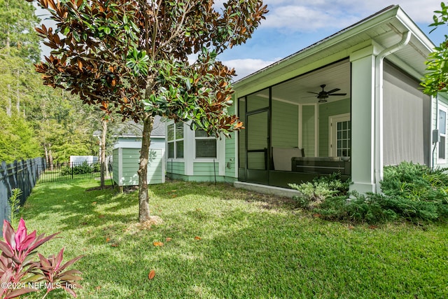 exterior space featuring a sunroom and ceiling fan