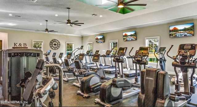 workout area with a textured ceiling and ceiling fan