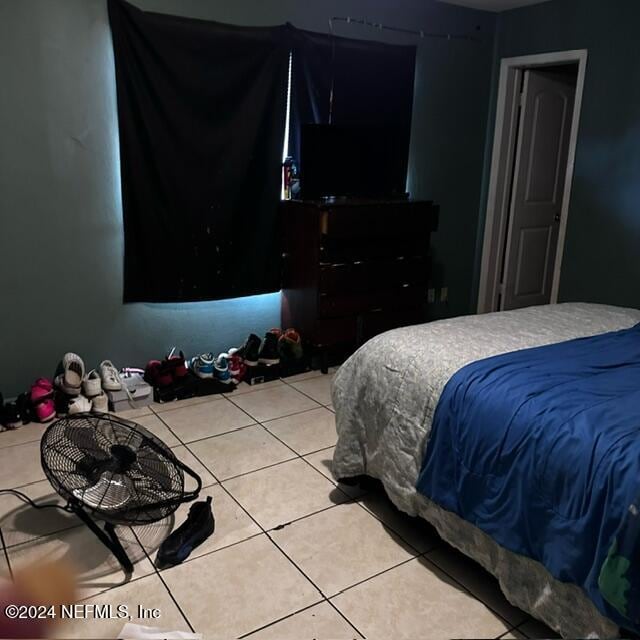 bedroom featuring tile patterned flooring