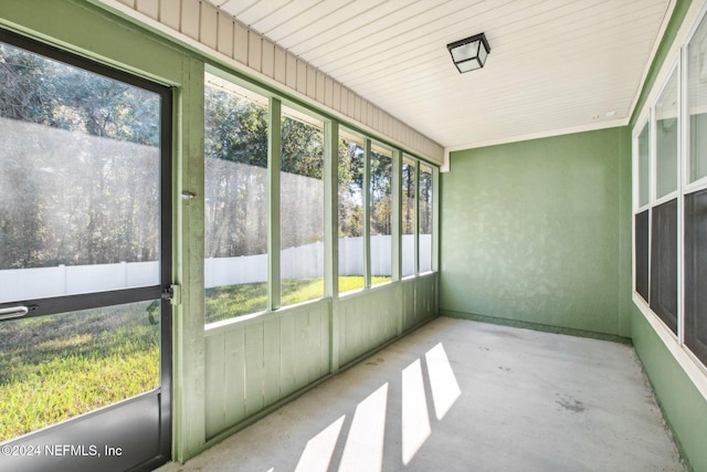 unfurnished sunroom featuring a wealth of natural light