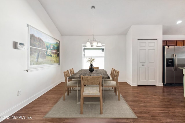 dining room with lofted ceiling, dark hardwood / wood-style floors, and a notable chandelier