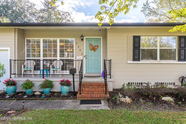 entrance to property with a porch