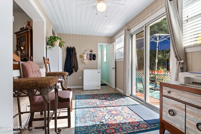 entryway with ceiling fan, wooden ceiling, and light tile patterned flooring