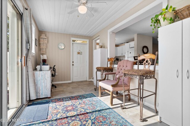 foyer entrance featuring ceiling fan and wood ceiling