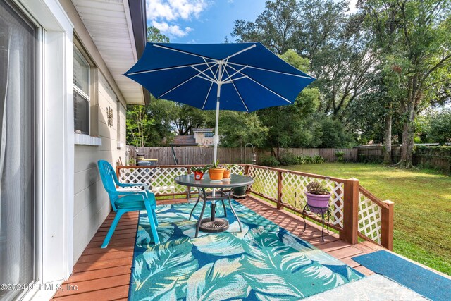 wooden deck with a yard