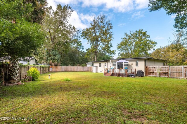 view of yard featuring a deck