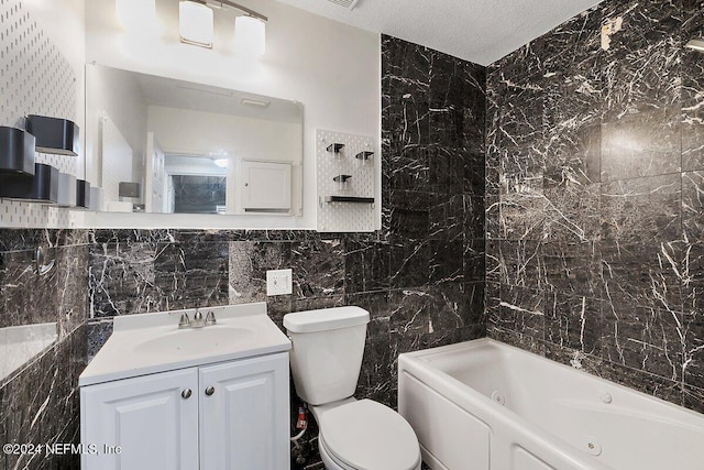 bathroom with a bathing tub, toilet, tile walls, and a textured ceiling