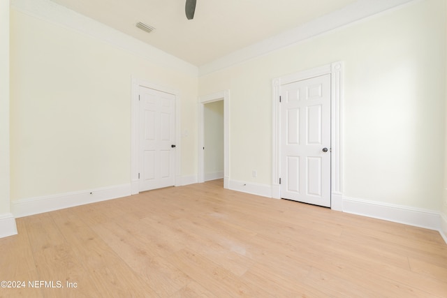 unfurnished bedroom featuring ceiling fan and light wood-type flooring