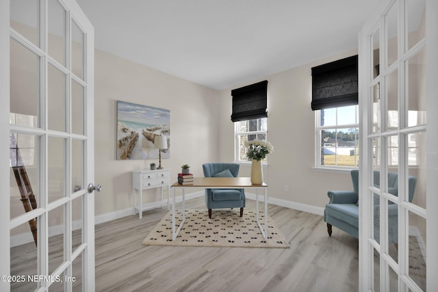 office space with french doors and light wood-type flooring