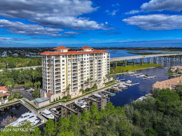 birds eye view of property with a water view