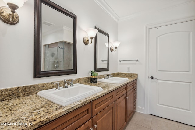 bathroom featuring vanity, tile patterned floors, and crown molding