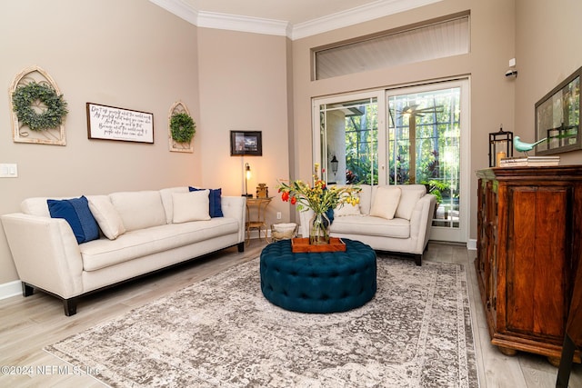 1854 W Cobblestone Ln, Saint Augustine, FL 32092 - living area with ornamental molding, light wood-style floors, and baseboards