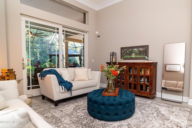 1854 W Cobblestone Ln, Saint Augustine, FL 32092 - living area with crown molding, wood finished floors, and baseboards
