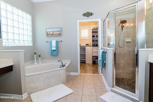 1854 W Cobblestone Ln, Saint Augustine, FL 32092 - full bath featuring a garden tub, a shower stall, tile patterned flooring, a walk in closet, and vanity