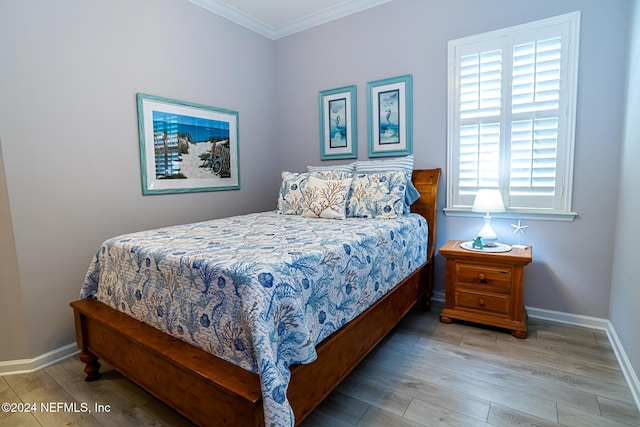 1854 W Cobblestone Ln, Saint Augustine, FL 32092 - bedroom featuring wood finished floors, ornamental molding, and baseboards