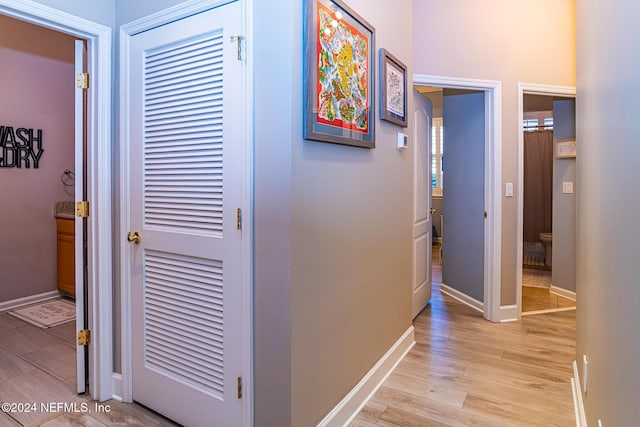 1854 W Cobblestone Ln, Saint Augustine, FL 32092 - hallway with light wood-style flooring and baseboards