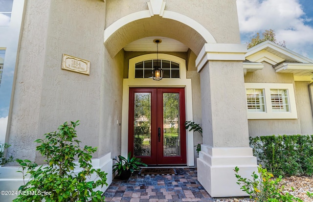 1854 W Cobblestone Ln, Saint Augustine, FL 32092 - property entrance featuring french doors and stucco siding
