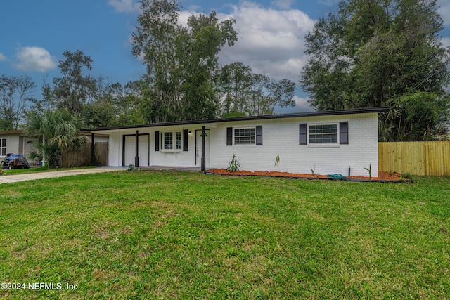 ranch-style home with covered porch and a front yard