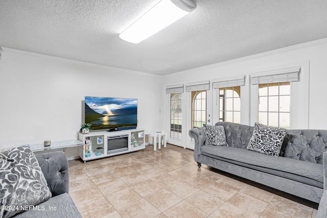 tiled living room featuring french doors, a textured ceiling, and crown molding