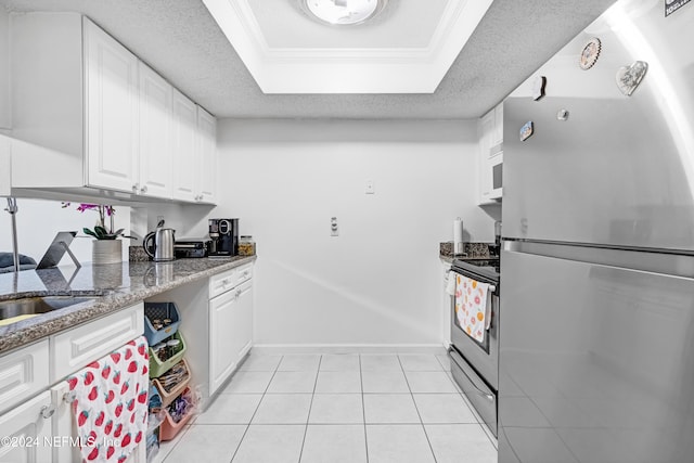 kitchen featuring a textured ceiling, stone countertops, white cabinetry, and stainless steel appliances