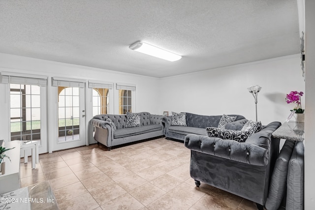 living room featuring french doors, light tile patterned floors, a textured ceiling, and ornamental molding