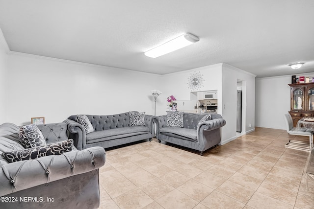 tiled living room with a textured ceiling and ornamental molding