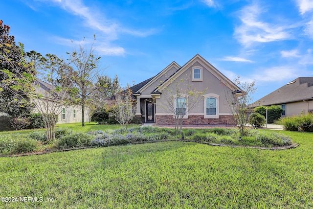 view of front of home featuring a front yard