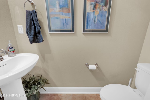 bathroom with tile patterned floors, toilet, and sink