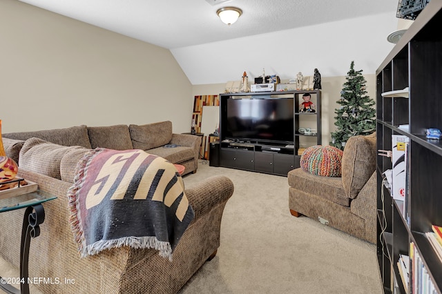 living room featuring carpet flooring and lofted ceiling