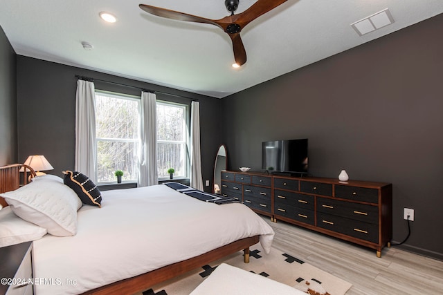 bedroom featuring ceiling fan and light hardwood / wood-style floors