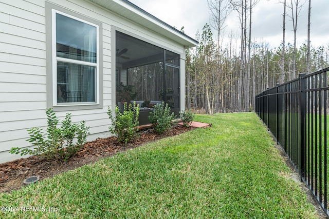 view of yard featuring a sunroom