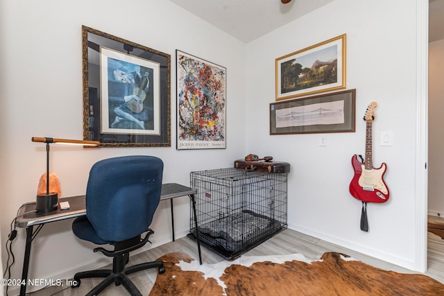 office with light wood-type flooring