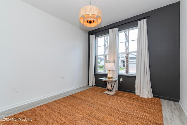 spare room with light wood-type flooring