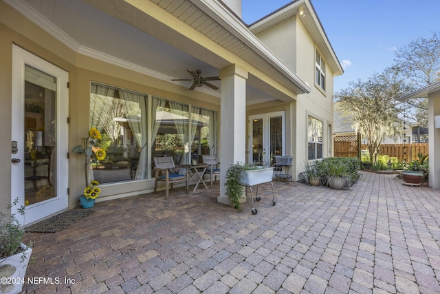 view of patio with ceiling fan and french doors