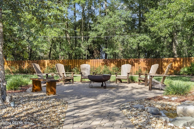 view of patio / terrace featuring a fire pit