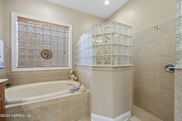 bathroom featuring separate shower and tub and vanity