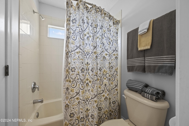 bathroom featuring toilet and shower / bath combo with shower curtain