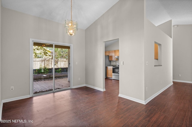 interior space featuring an inviting chandelier, dark wood-type flooring, baseboards, and high vaulted ceiling