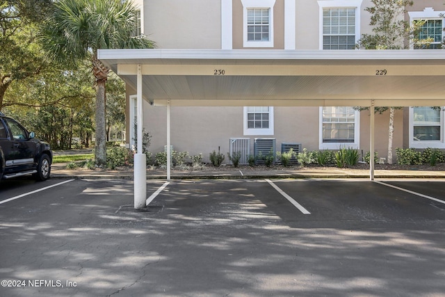 view of vehicle parking featuring a carport