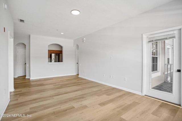 spare room featuring light hardwood / wood-style flooring