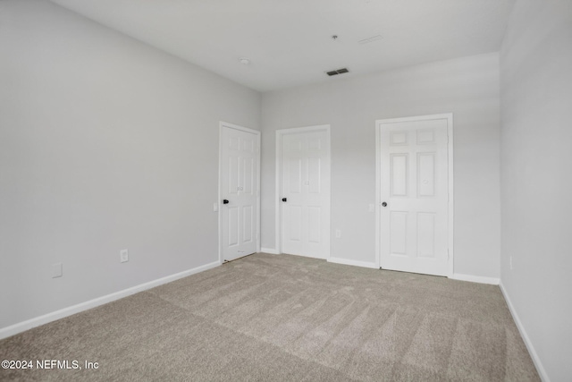 spare room with carpet floors