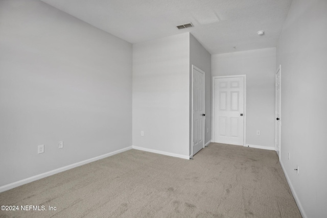 empty room featuring carpet flooring