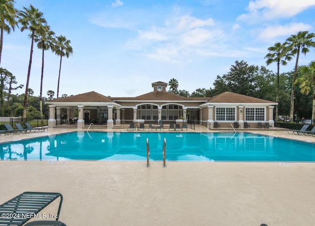 view of swimming pool with a patio area